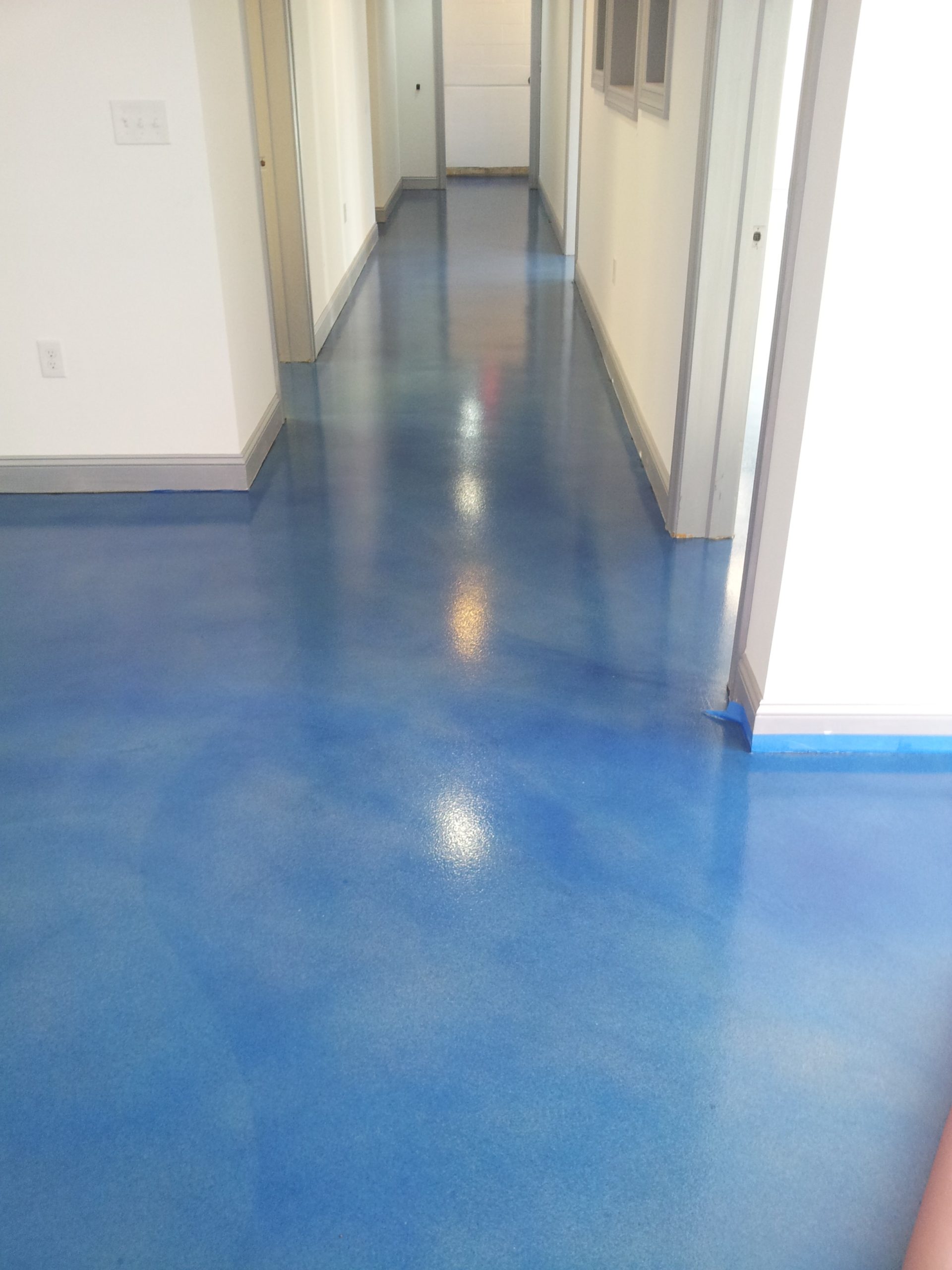 Poured Cement Floor Dye and Seal Poured cement flooring at Cressi showroom in Saddle Brook NJ | Duraamen Engineered Products Inc
