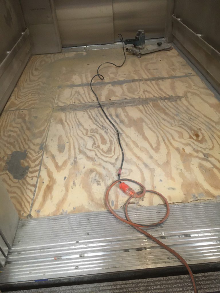 Elevator cab floor is prepared to have an epoxy coating installed