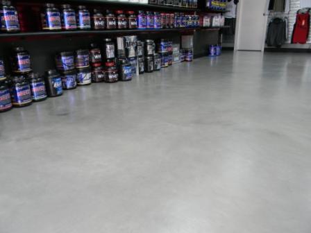 Pentimento Concrete Overlay Brooklyn NY Concrete Topping Installation in a Nutrition Store in Brooklyn NY | Duraamen Engineered Products Inc