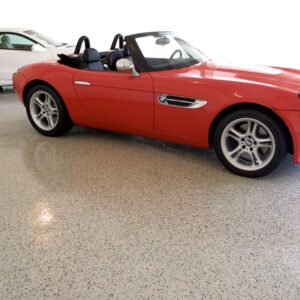 This high shine epoxy resin chip floor showcases these high-end sports cars.