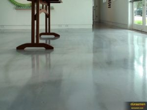 This photo illustrates the high-gloss and deep color of Duraamen's metallic epoxy flooring.