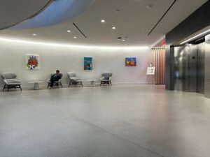 Self-leveling concrete topping with polyurethane topcoat. FISERV Financial Technology Services, WI, USA. elevator lobby 2