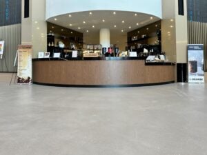Self-leveling concrete topping with polyurethane topcoat. FISERV Financial Technology Services, WI, USA. Cafeteria 2