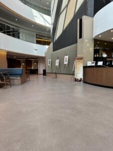 Self-leveling concrete topping with polyurethane topcoat. FISERV Financial Technology Services, WI, USA. Cafeteria