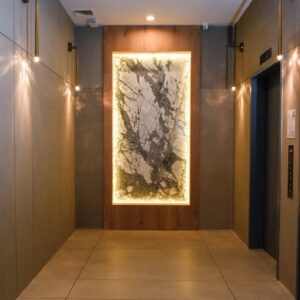 Modern lobby with Skraffino microtopping flooring and wooden wall accents in.