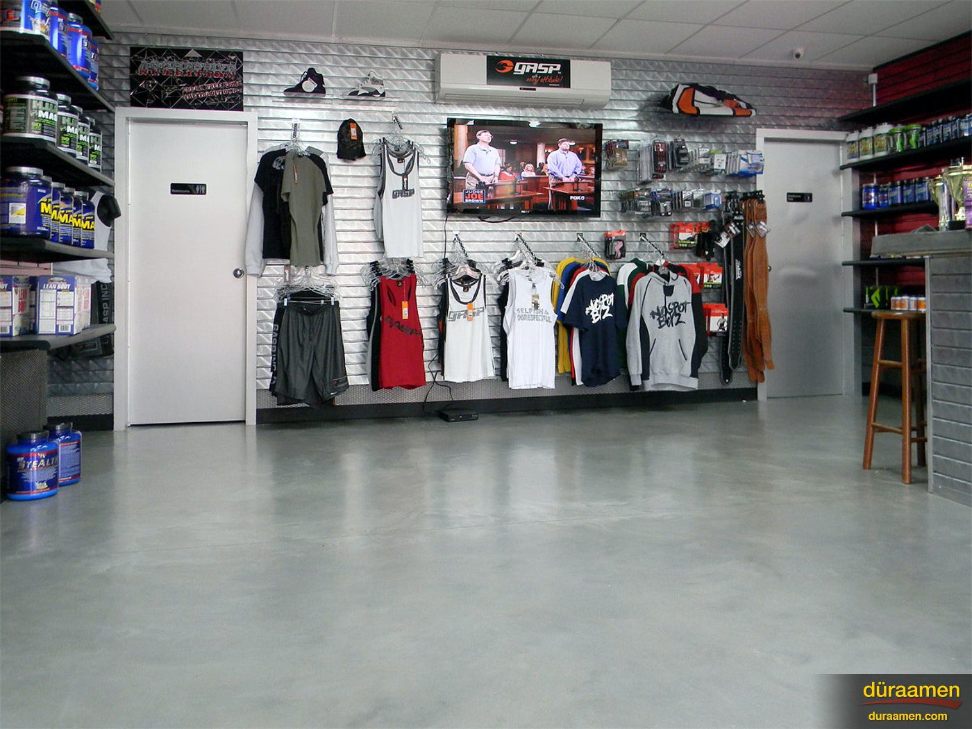 The merchandise of this fitness retailer stands out thanks to the clean smooth contemporary concrete overlay flooring Commercial and Industrial Flooring Solutions Why Epoxy Reigns Supreme | Duraamen Engineered Products Inc