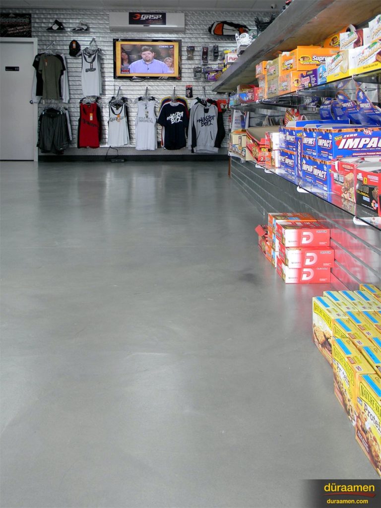 The view down one wall shows how the merchandise stands out against the subtle color choice for the concrete floor.