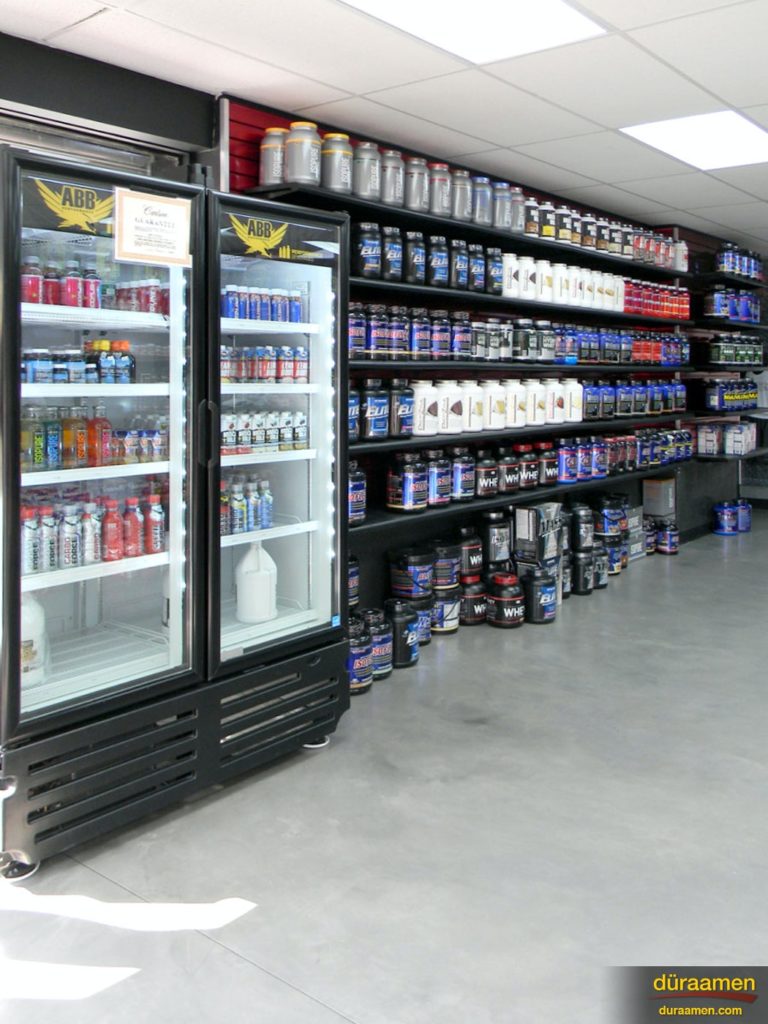A resurfaced concrete floor is low maintenance and resists spills, perfect for a retailer who sells food products such as this fitness store.