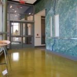 The hallways in this building at Southern Connecticut State University were resurfaced using Pentimento semi-self-leveling concrete from Duraamen.
