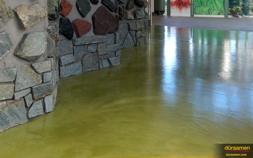 The newly resurfaced concrete floor's texture compliments the stone textured walls in this facility at Southern Connecticut State University (SCSU).