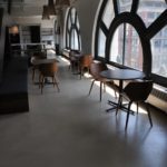 This unique conference space features expansive views of NYC and the comfort and style of a Duraamen resurfaced concrete floor.