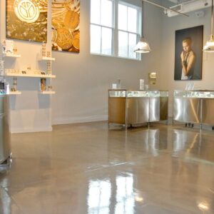 The beautiful, high-gloss, resurfaced concrete floor of Alex & Ani retail store on NYC.