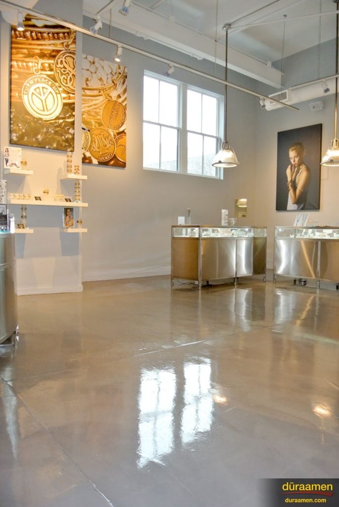 The beautiful, high-gloss, resurfaced concrete floor of Alex & Ani retail store on NYC.