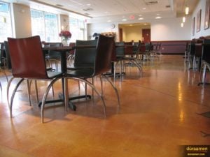 This photo shows the semi gloss sheen of this polished concrete floor. Polished concrete can be polished to any level of gloss.