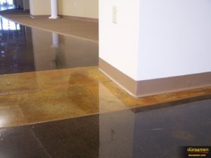 Concrete was ground and then subsequently colored with DESO dyes followed by water based epoxy sealer and solvent based polyurethane top coat.