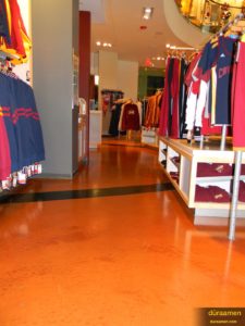 Another view of merchandise reflecting off the metallic epoxy floor in the Cleveland Cavaliers Team Shop.