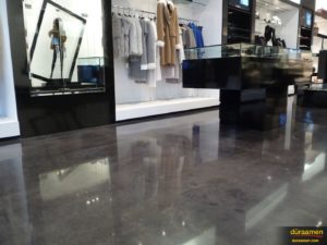Merchandise in this clothing store looks spectacular hung above the high gloss floor.
