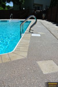 The area around this pool has been resurfaced with Duraamen's Uberdek, an exterior concrete resurfacing product.