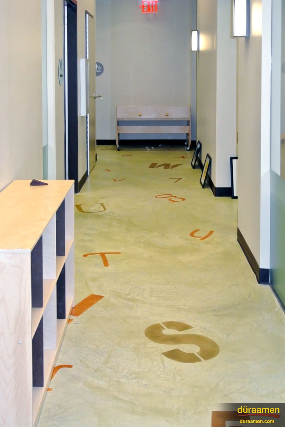 A resurfaced concrete floor yields many design possibilities. This daycare center had letters and numbers stenciled on the floor using playful colors.