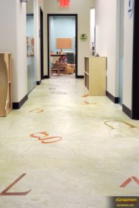 The resurfaced concrete floor was created with Skraffino concrete microtopping from Duraamen.