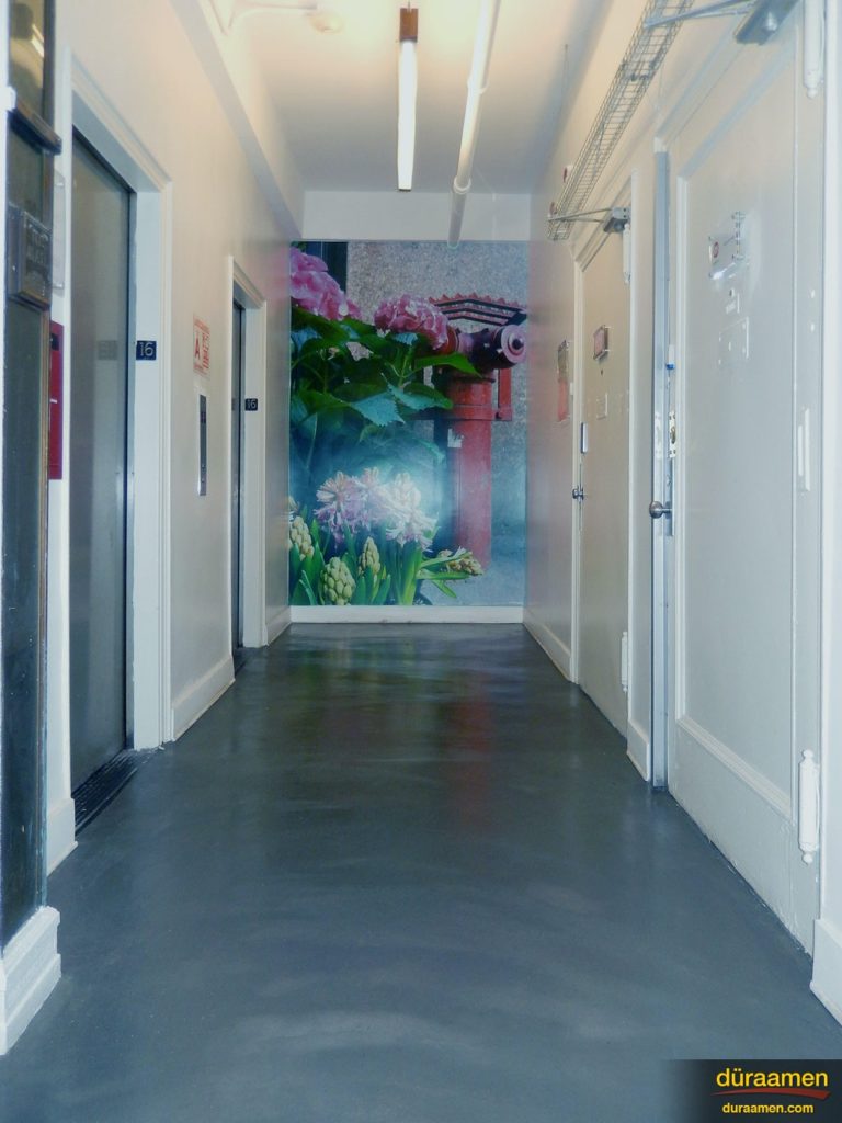 This New York City office hallway was resurfaced with Skraffino concrete microtopping.