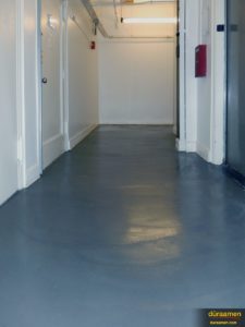 Another view of the hallway flooring that's been resurfaced in this New York City office space.