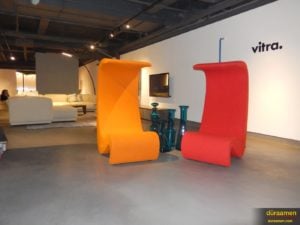 Bright colors juxtaposed against the subtle grey resurfaced concrete floor give life to the gallery's collection.