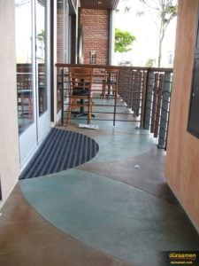 Skraffino concrete microtopping overlay was integrally colored to create the beautiful earth and green tones of for this outdoor balcony.