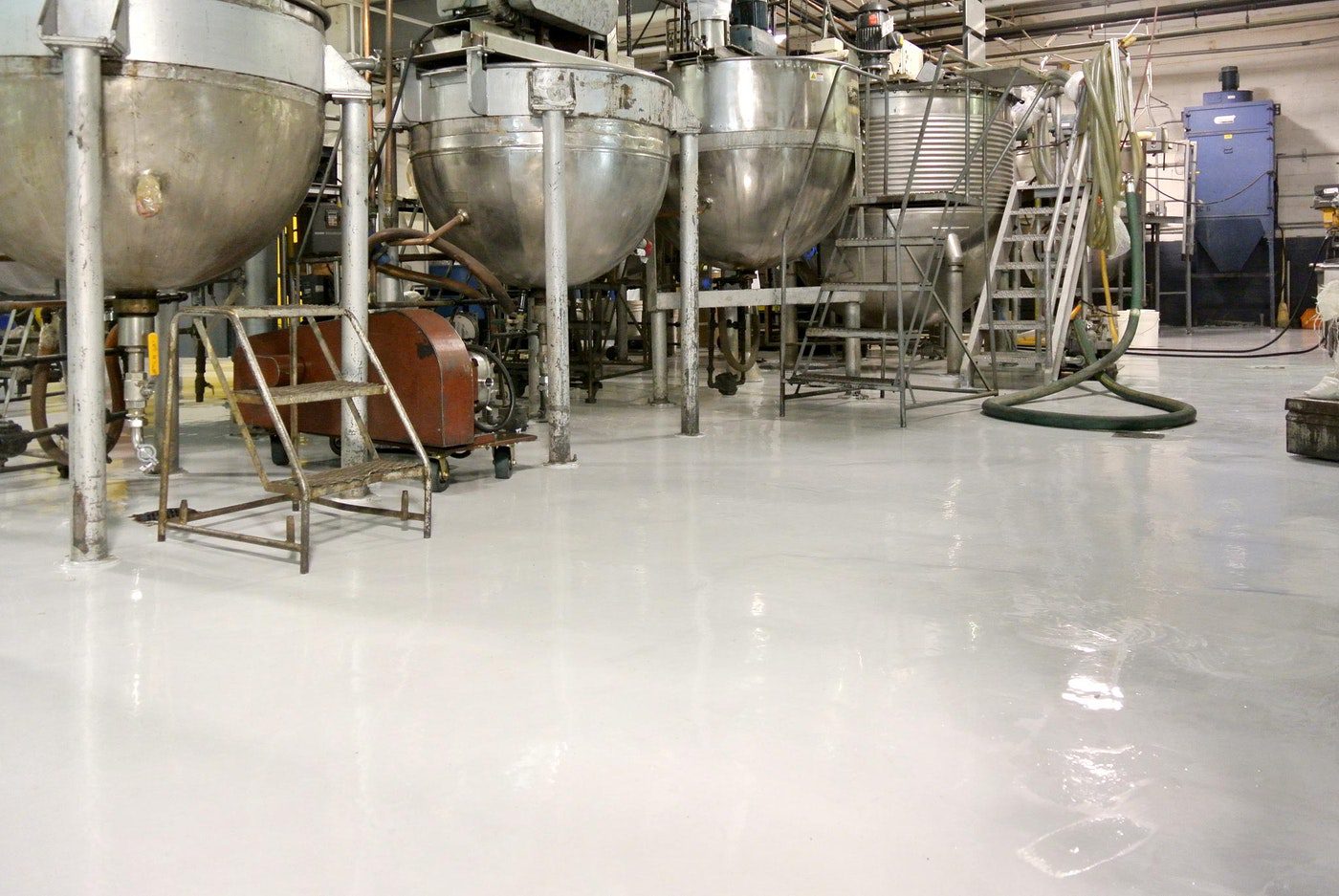 Industrial epoxy floor coating Razac Products Epoxy Floor Coatings Protecting the Concrete Floor in a Factory | Duraamen | Duraamen Engineered Products Inc