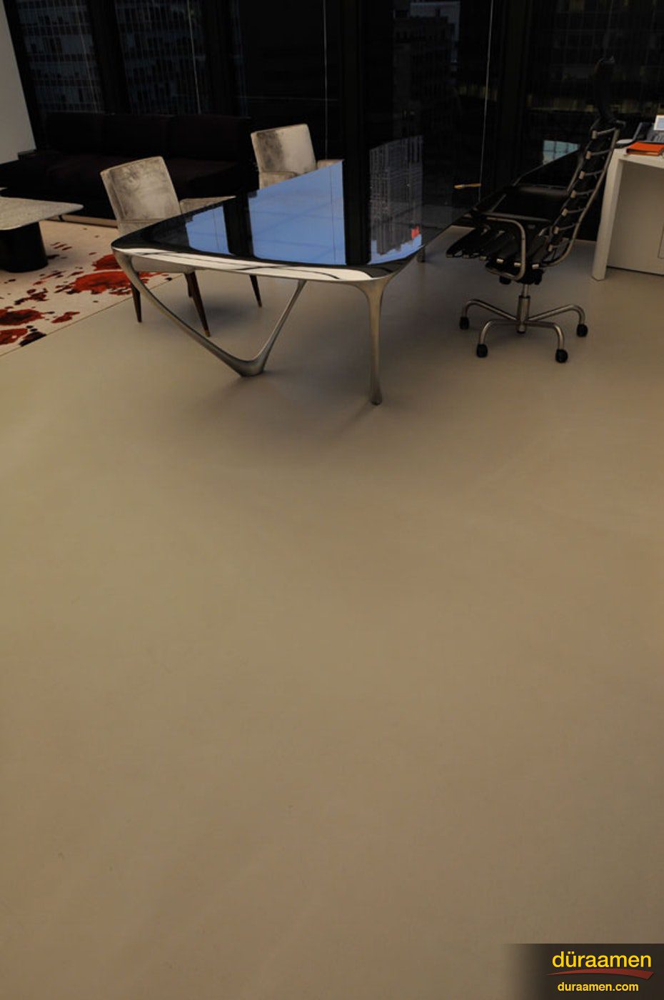 The concrete microtopping used for this firms office space helps give it a modern feel Concrete floors in a financial consulting firm in New York | Duraamen Engineered Products Inc