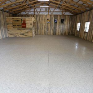 Garage floor with epoxy chip floor coating and non-slip surface in a large barn garage