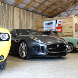 A garage floor coated with epoxy chip floor coating, showcasing a blend of multi-colored chips in shades of blue, gray, and white.