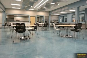 The cafeteria is a more pleasant place to dine thanks to the metallic epoxy flooring.