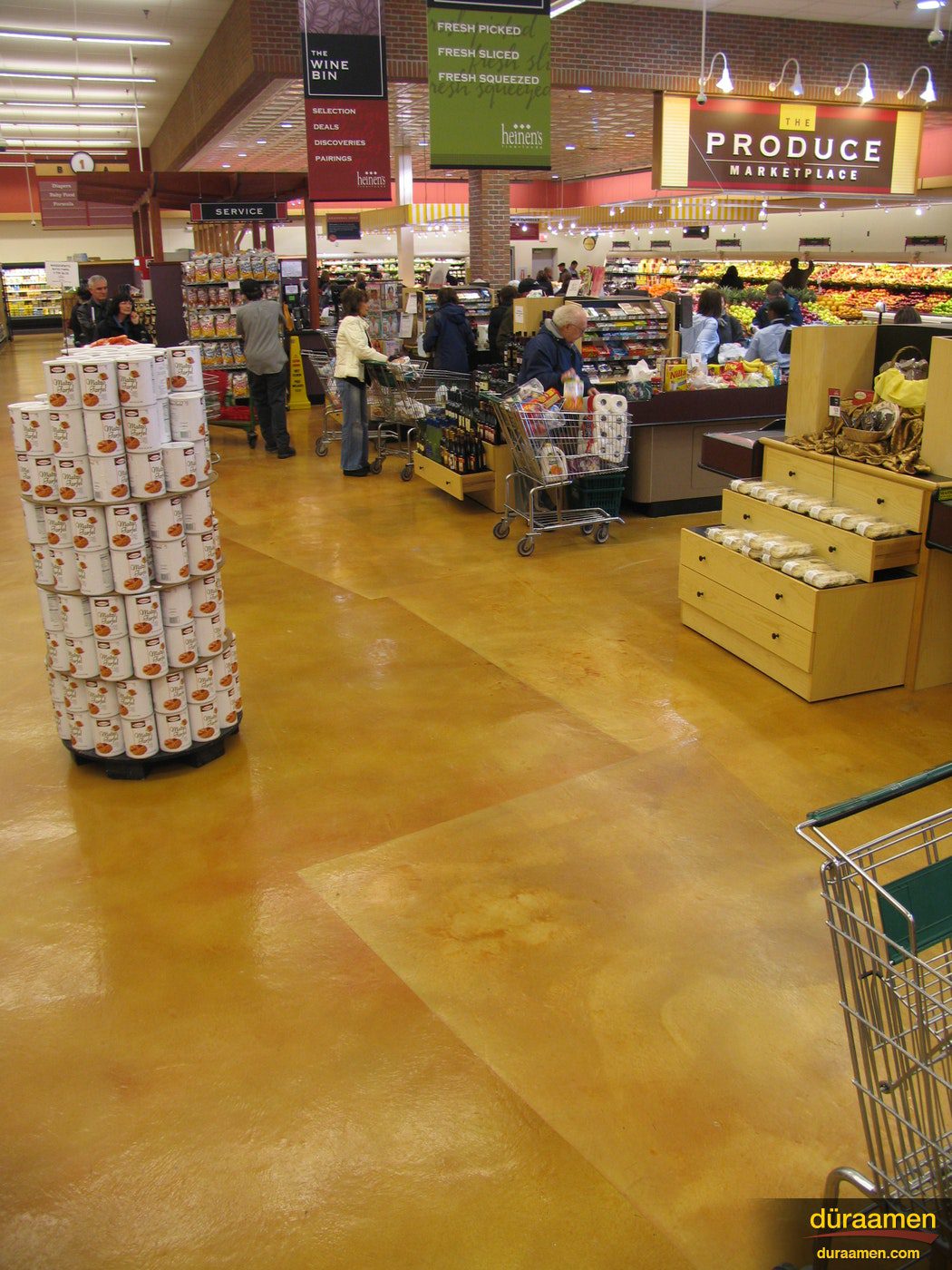The checkout section of the Hudson Ohio Heinens shown with Concrete Microtopping Skraffino was used and subsequently dyed with DESO dyes Heinens Foods Hudson OH | Duraamen Engineered Products Inc