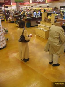 The flooring in the Hienen's grocery store is a concrete microtopping, Skraffino that was subsequently dyed with DESO dyes. Sealed with water based epoxy and polyurethane.