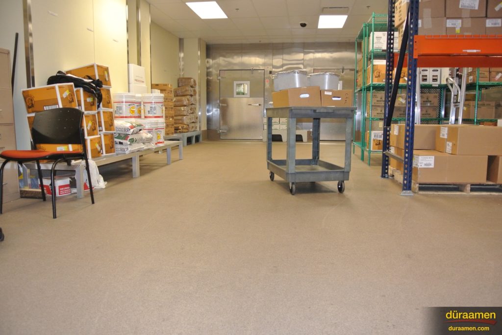 The decorative quartz flooring used in this commercial kitchen looks great from all sides.
