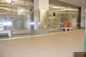The flooring is installed all the up to the entry doors of the commercial grade walk-in freezers.