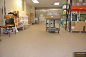 The decorative quartz flooring used in this commercial kitchen looks great from all sides.