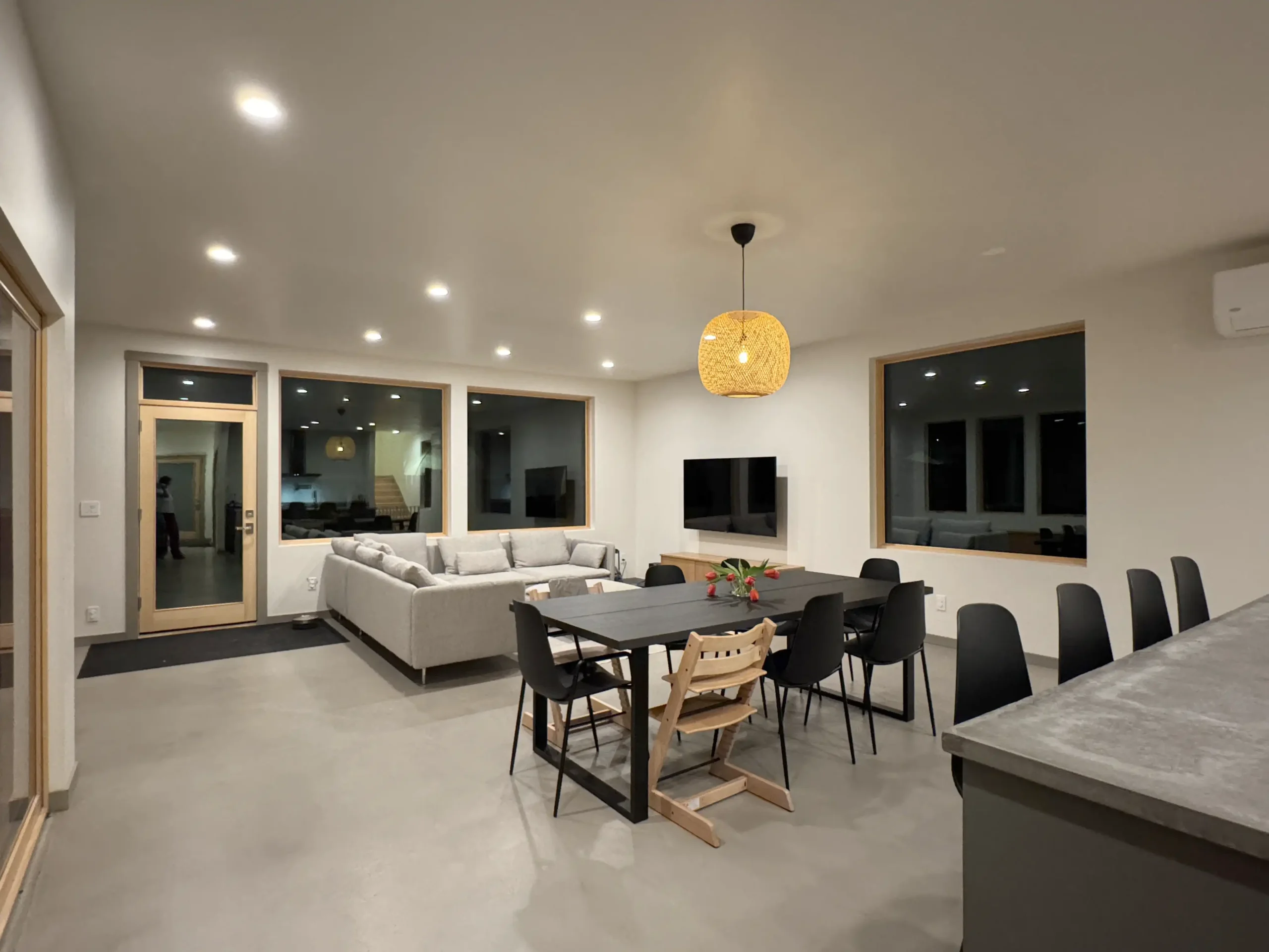 Modern living space with light gray Arapido microcement flooring Microcement floors in Hungry Horse MY by North Brother Builders | Duraamen Engineered Products Inc