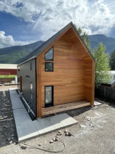 Exterior view of modern home with wood and black siding in Hungry Horse, Montana.