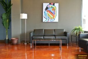 Metallic epoxy flooring provides a high-end feel, perfect for the lobby of this chirpractic office.