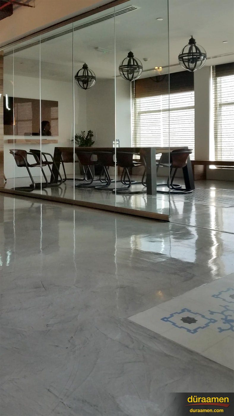 A view of the supper sleek concrete micro topped floor in the conference room of JWT Dubai Polished Concrete Floors in Advertising Agency in Dubai UAE | Duraamen Engineered Products Inc
