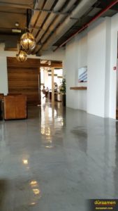 The gloss appearance of the concrete overlay flooring in the offices of JWT Dubai, is just one of many types of finishes that can be had using our concrete resurfacing product, Skraffino microtopping/skimcoat.