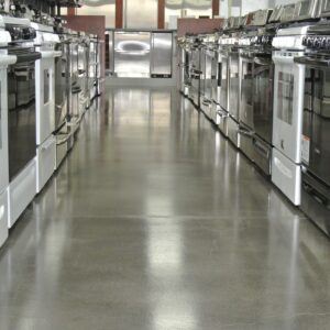 Appliances appear brighter with a polished concrete floor.