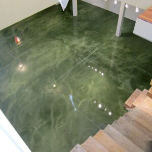This building entrance has had it's flooring enhanced with a striking green color using metallic epoxy.