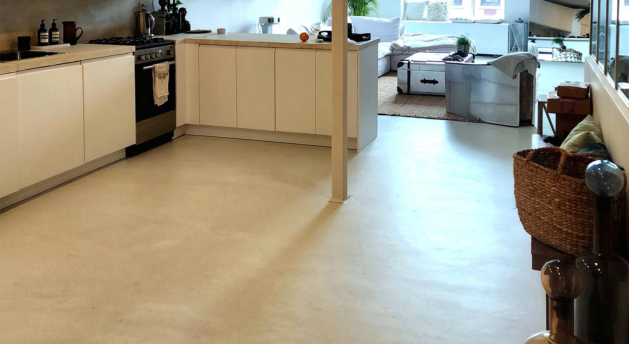 Skraffino microtopping in kitchen Concrete Microtopping Over Radiant Heat Flooring | Duraamen Engineered Products Inc