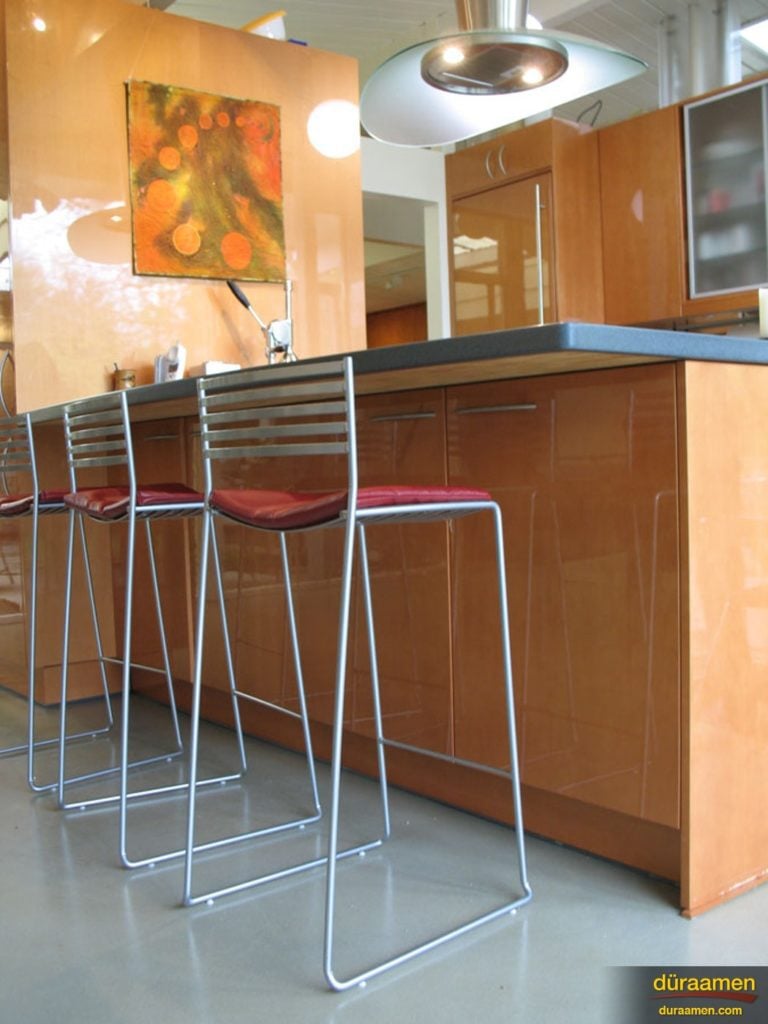 This bar benefits from the contemporary look and feel of concrete overlay flooring.