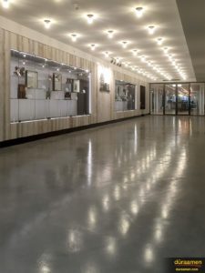 The the gloss sheen and aesthetic texture for this corridor's floor was created with products chosen by the architect.