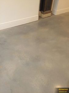 A detail photo of the new self-leveling concrete floor in this contemporary shared office space.