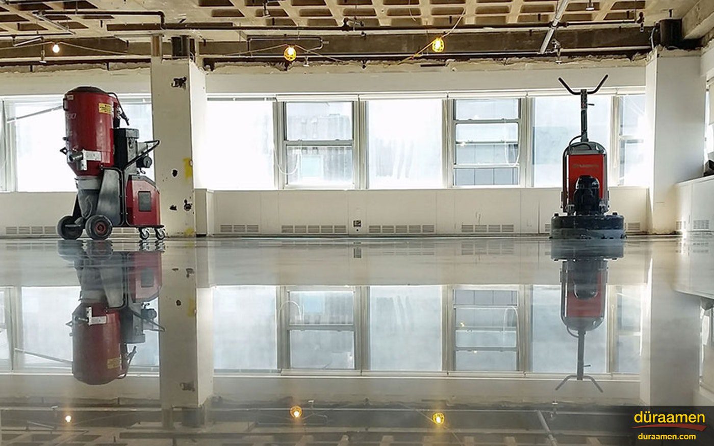 Diamond grinding machines in a NYC office space ready to complete the polishing of the newly installed polished concrete floor Polished Concrete In Process | Duraamen Engineered Products Inc